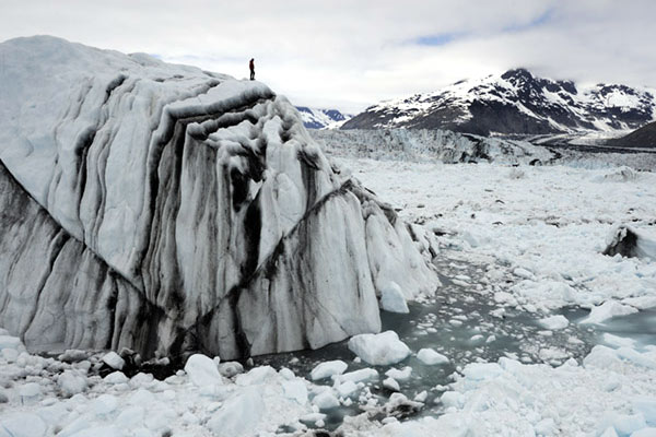 Adam-LeWinter-on-iceberg-in-Columbia-Bay_extreme-ice-survey.jpg